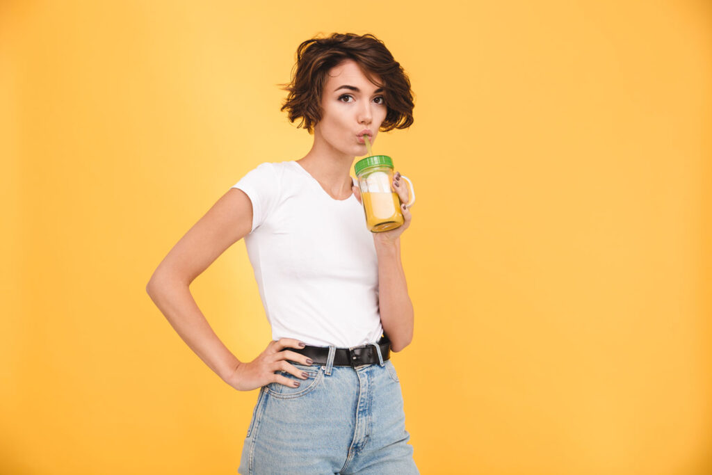 portrait-lovely-casual-woman-drinking-orange-juice